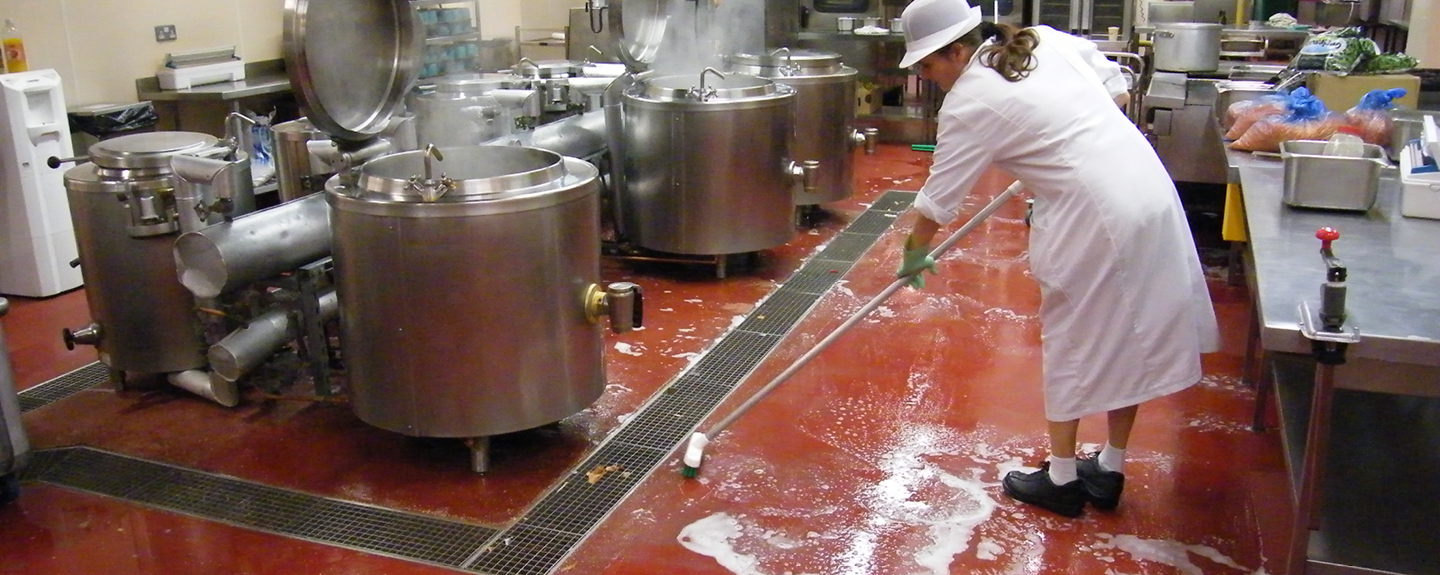 A commercial kitchen resin floor being cleaned